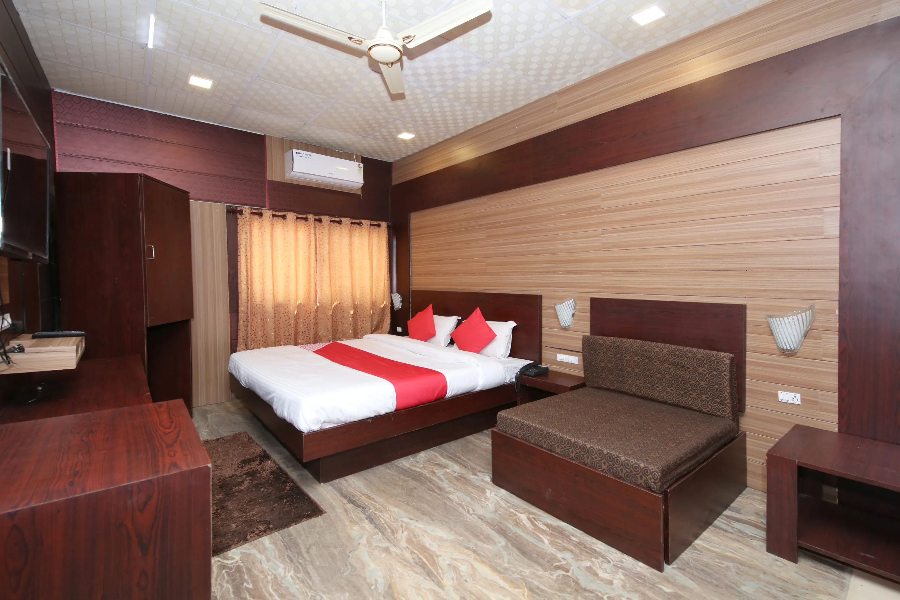 A clean, air-conditioned double room at Hotel E Square, Vijay Nagar, Jabalpur